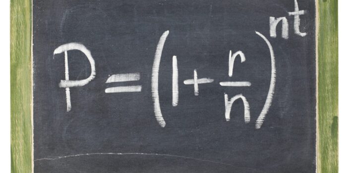 compound interest equation - white chalk handwriting on a small slate blackboard, isolated with clipping path