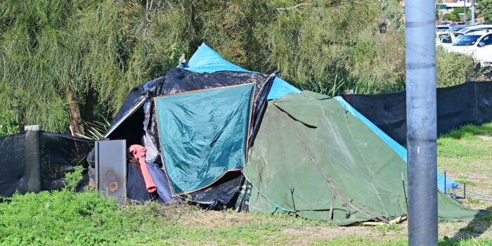 Homeless person living in a tent in Newcastle Australia